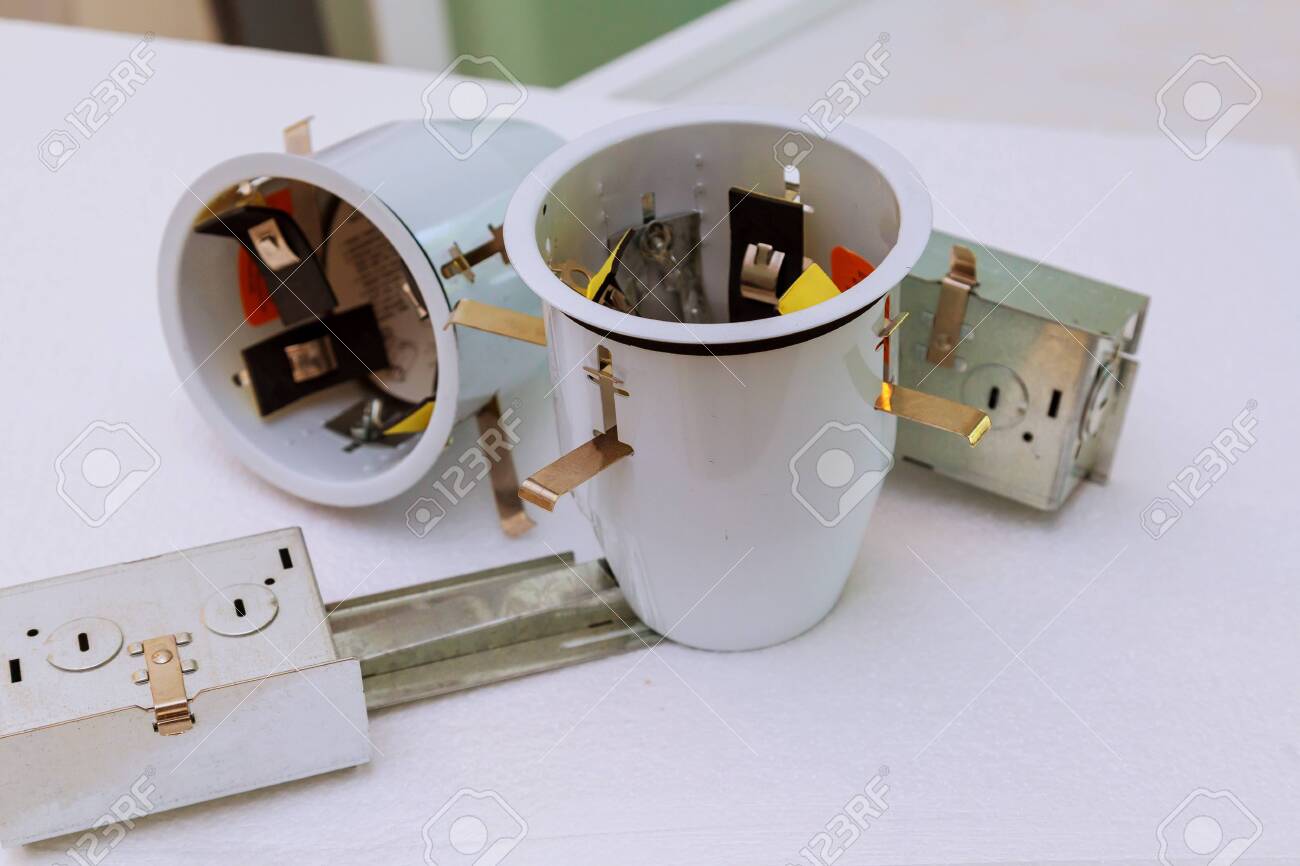 The Electrician Assembles Ceiling Lights System Installation