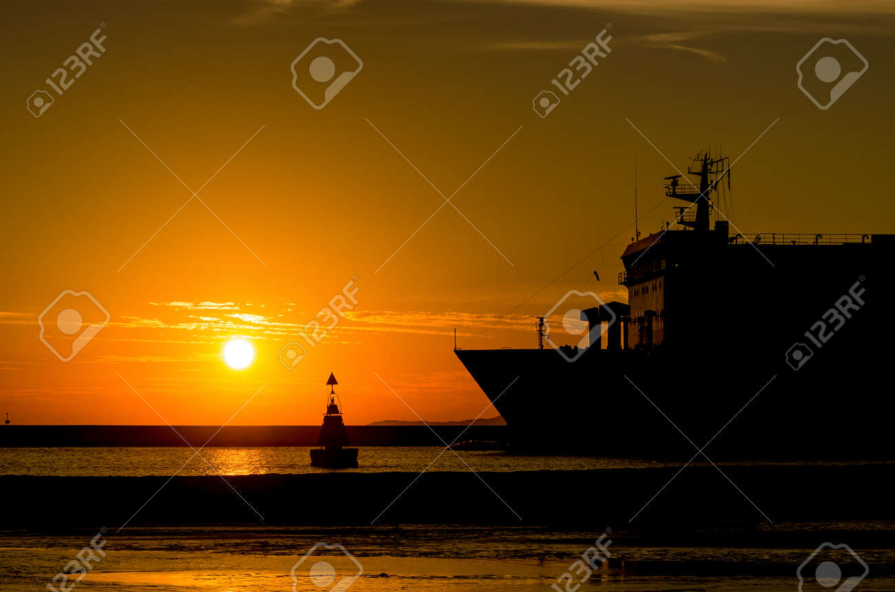 PASSENGER FERRY - Sunrise over a ship going on a sea cruise - 171403207 PASSENGER FERRY - Sunrise over a ship going on a sea cruise - 171403207
