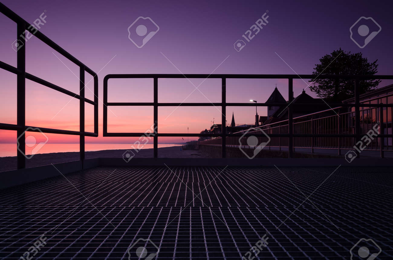 SUNRISE OVER THE SEASHORE - A colorful morning on the promenade - 169541031 SUNRISE OVER THE SEASHORE - A colorful morning on the promenade - 169541031
