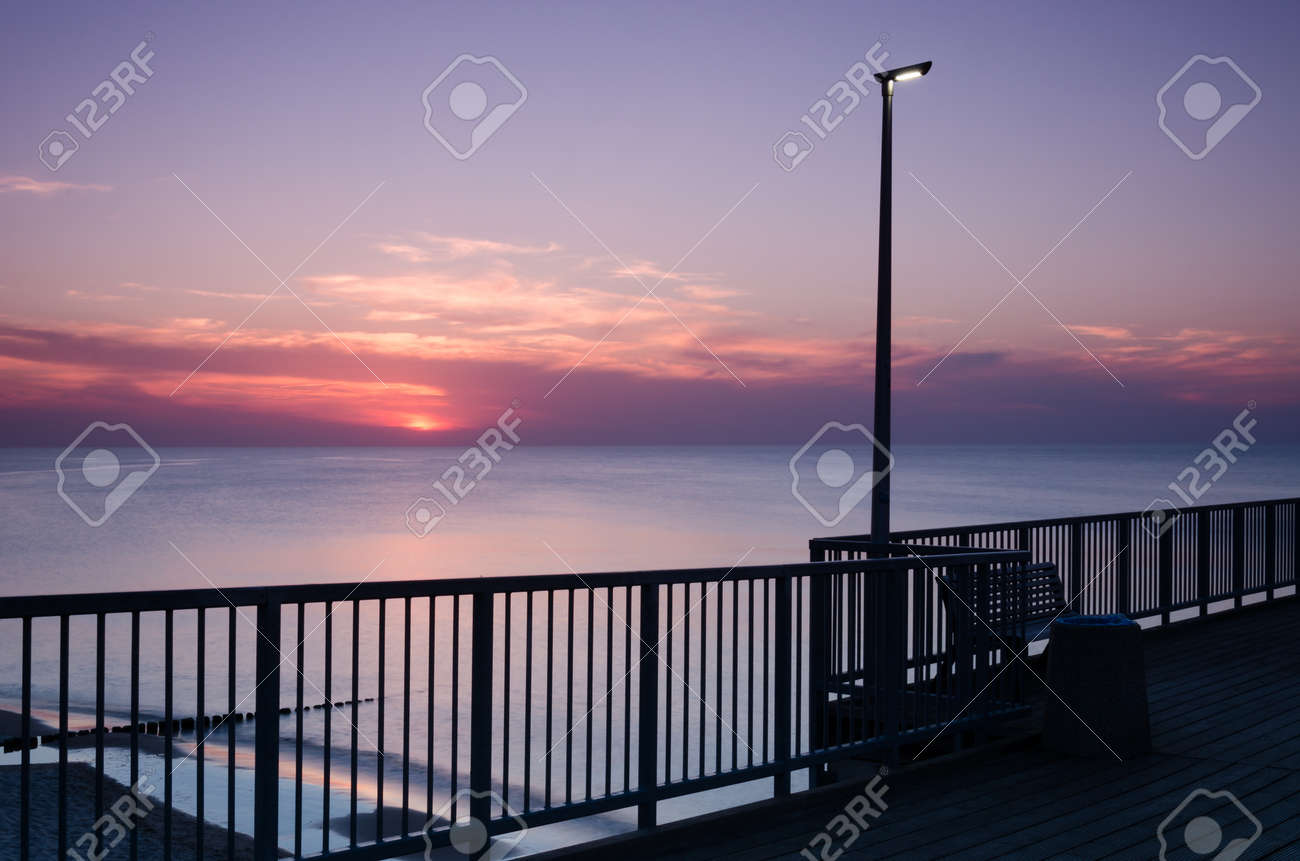 SUNSET OVER THE SEASHORE - Evening walk to the pier - 169541111 SUNSET OVER THE SEASHORE - Evening walk to the pier - 169541111