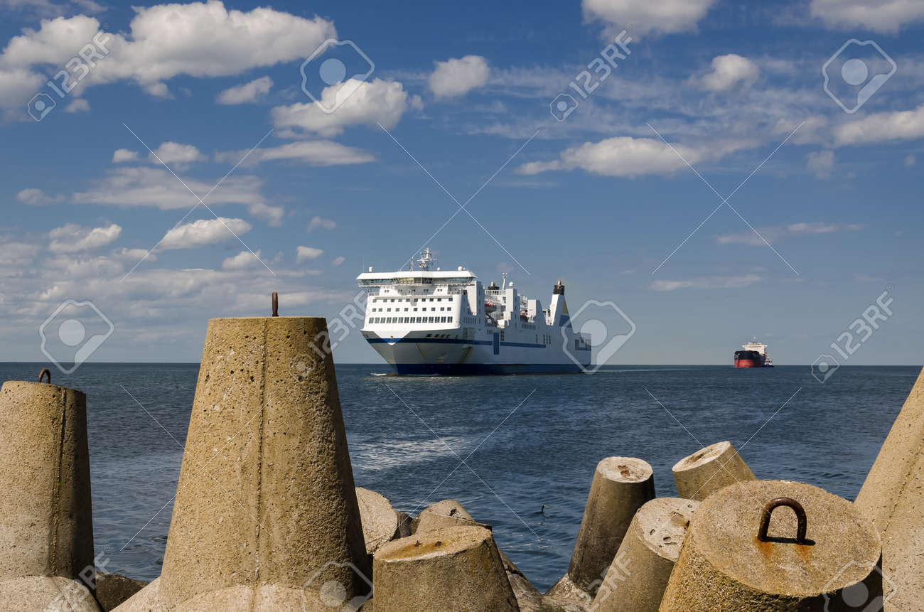 MARITIME TRANSPORT - Passenger ferry and bulk carrier on waterway to the port - 171257414 MARITIME TRANSPORT - Passenger ferry and bulk carrier on waterway to the port - 171257414