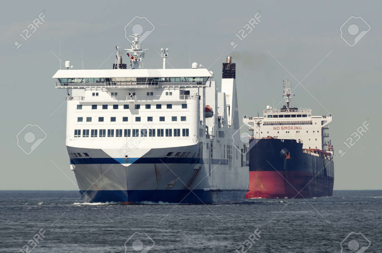MARITIME TRANSPORT - Passenger ferry and bulk carrier on waterway to the port - 171410614 MARITIME TRANSPORT - Passenger ferry and bulk carrier on waterway to the port - 171410614