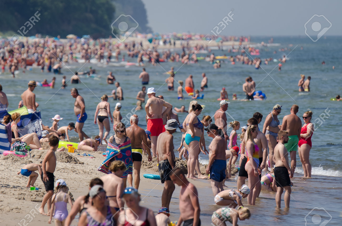 SARBINOWO, WEST POMERANIAN / POLAND - 2021: Holidaymakers relacreation on the sunny sea beach - 171646420 SARBINOWO, WEST POMERANIAN / POLAND - 2021: Holidaymakers relacreation on the sunny sea beach - 171646420