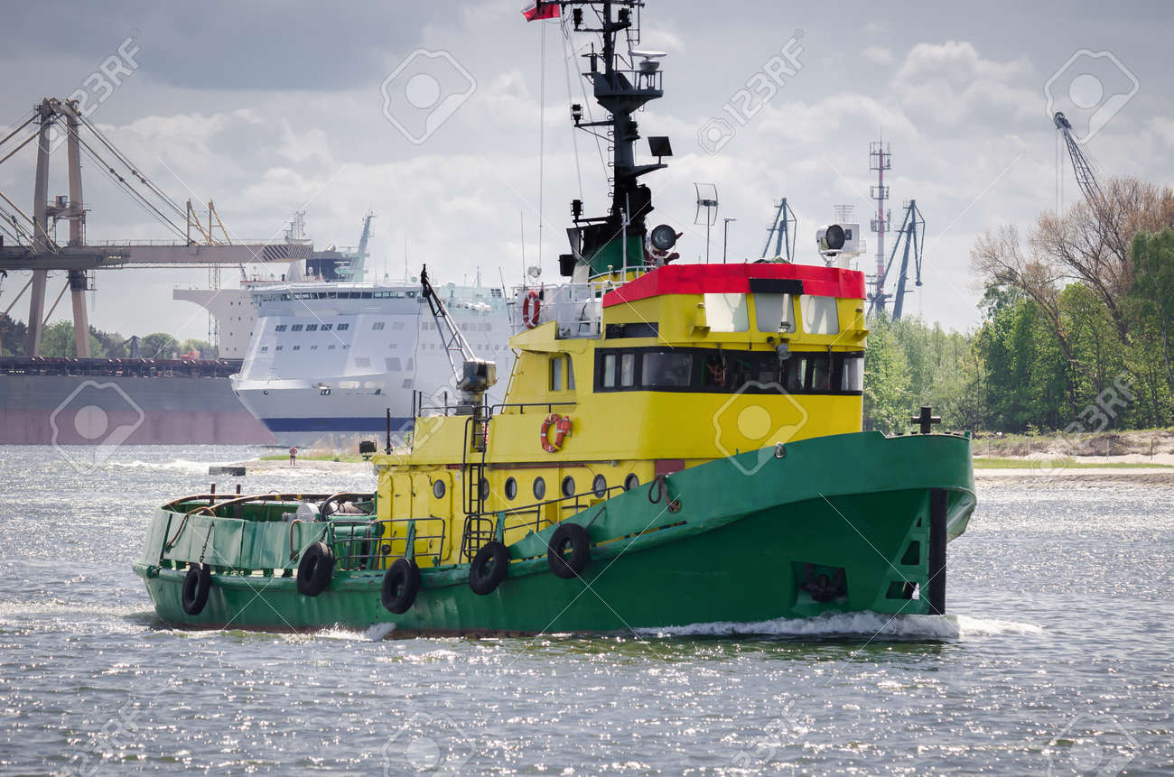 TUGBOAT - Auxiliary vessel sails in the seaport background - 171665922 TUGBOAT - Auxiliary vessel sails in the seaport background - 171665922