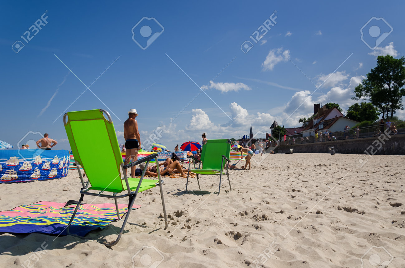 SARBINOWO, WEST POMERANIAN / POLAND - 2021: Holidaymakers relacreation on the sunny sea beach - 171646421 SARBINOWO, WEST POMERANIAN / POLAND - 2021: Holidaymakers relacreation on the sunny sea beach - 171646421