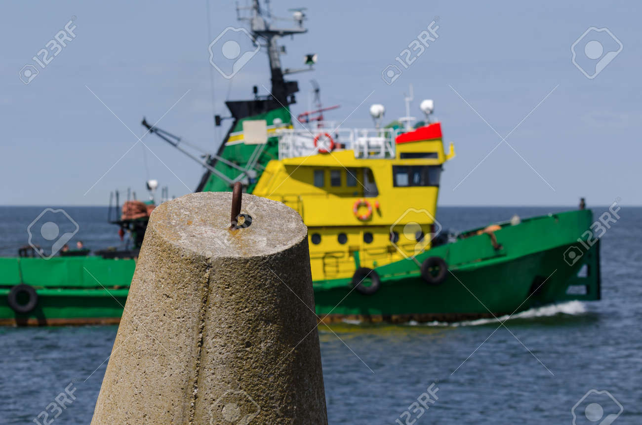 DOLOS AND TUGBOAT - Coastal fortifications against the background of the auxiliary ship - 171900242 DOLOS AND TUGBOAT - Coastal fortifications against the background of the auxiliary ship - 171900242