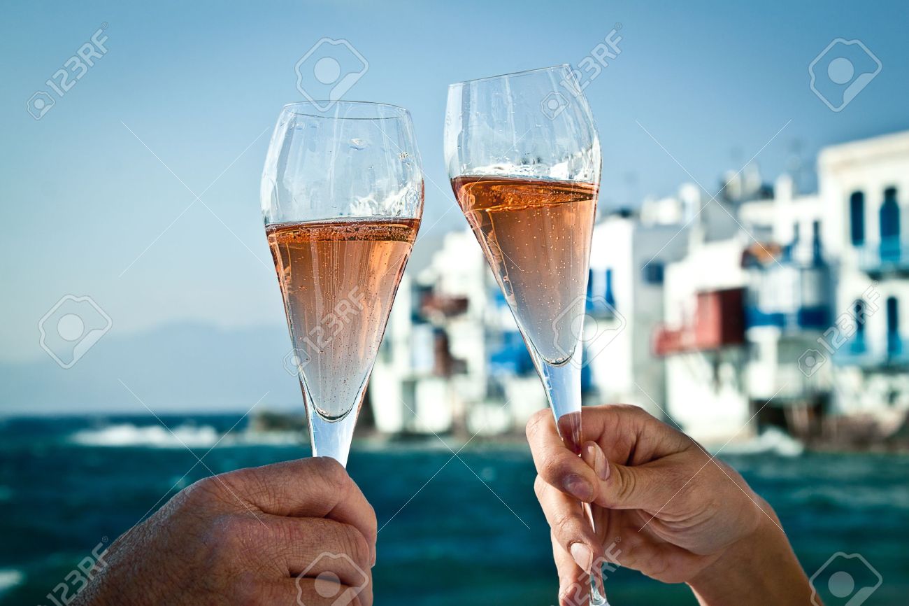 A romantic toast by the sea in Greece - 13897663 A romantic toast by the sea in Greece - 13897663