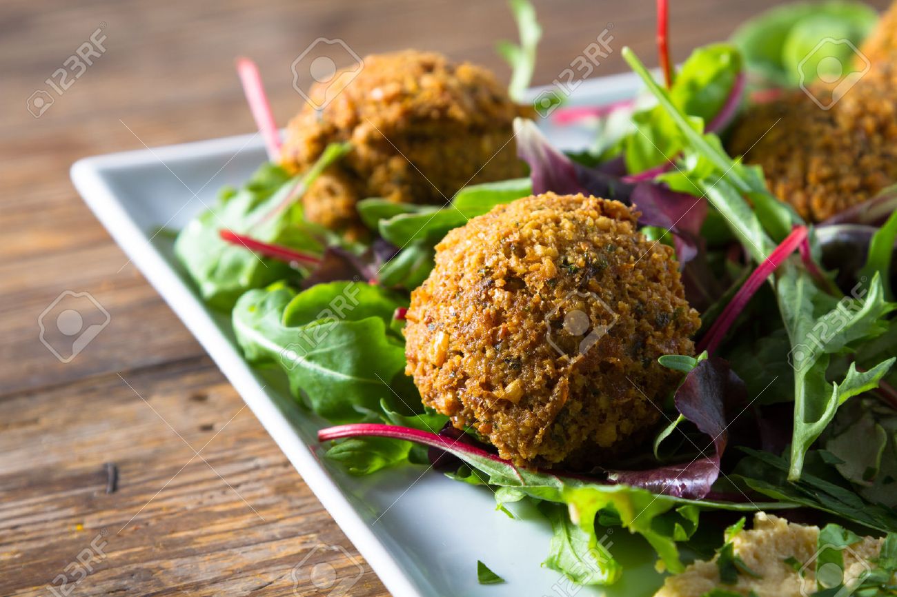 Middle East cuisine: a plate of delicious falafels and hummus. Vegetarian fare. - 22953543 Middle East cuisine: a plate of delicious falafels and hummus. Vegetarian fare. - 22953543