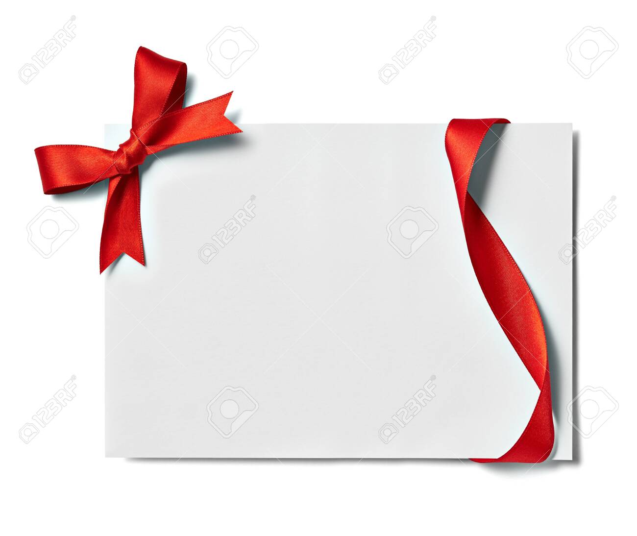 close up of a note card with red ribbon bow on white background - 134101877 close up of a note card with red ribbon bow on white background - 134101877
