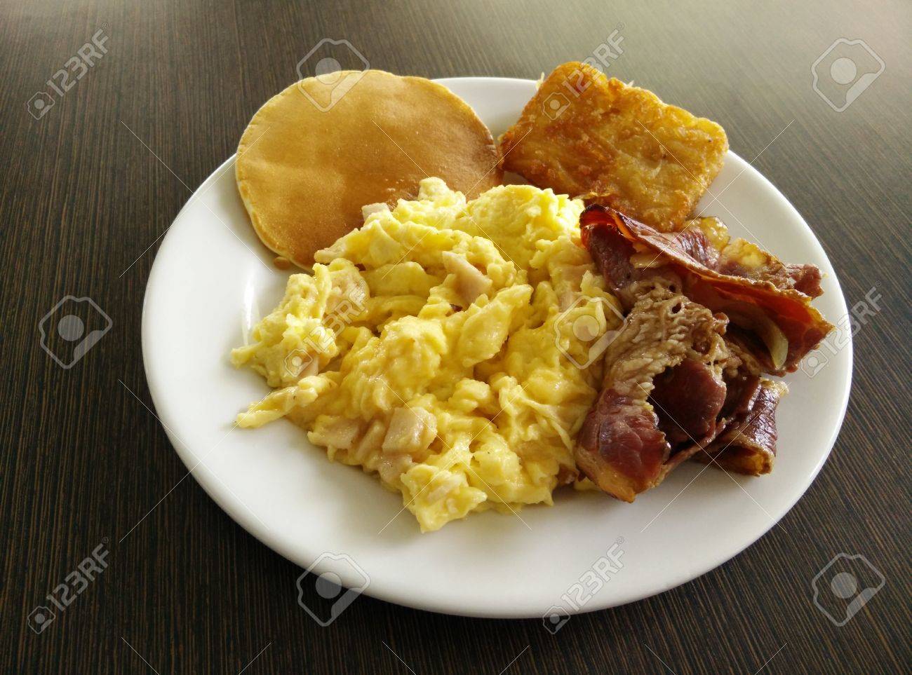 Breakfast With Scrambled Eggs Bacons Pancakes And Fried Potato Stock Photo Picture And Royalty Free Image Image