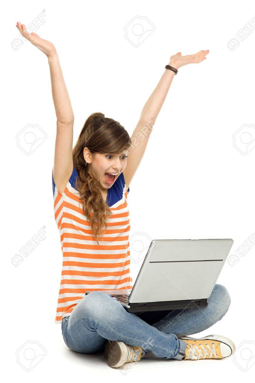 Woman with arms raised using laptop - 12037852 Woman with arms raised using laptop - 12037852