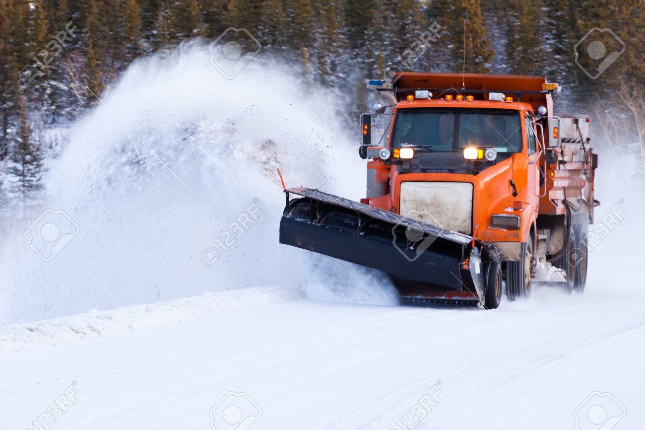 Snow Plow Truck Clearing Road After Winter Snowstorm Blizzard Stock Photo Picture And Royalty Free Image Image 79080278