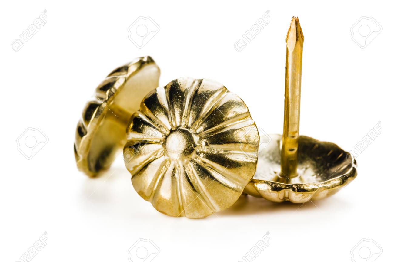decorative nails for furniture. decorative furniture nails for upholstery and drapery of furniture, close-up, on white m