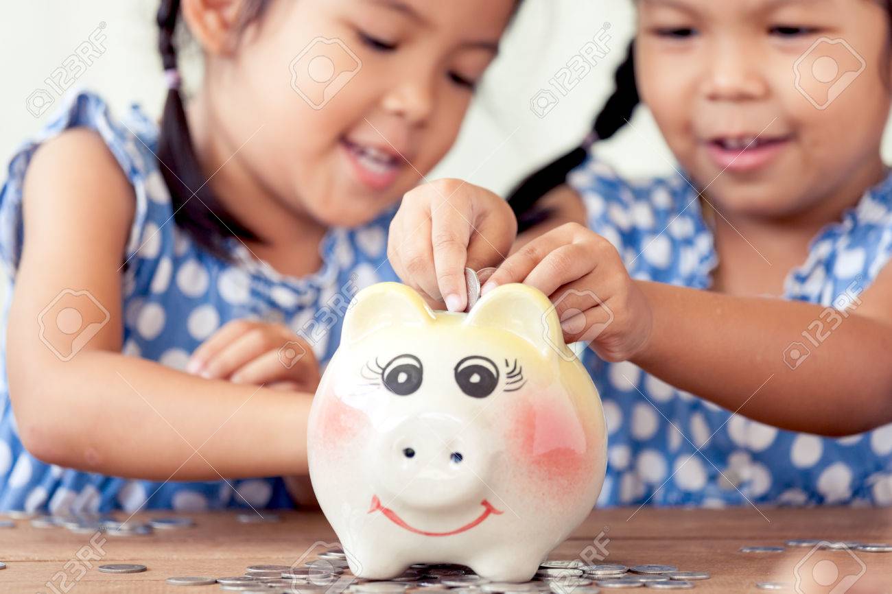 fun piggy banks for kids stock photo two asian little girls having fun to put coin into piggy bank togetherkid saving money for the future concept asian little girls having fun to put coin into fun piggy banks for kids stock photo two asian little girls having fun to put coin into piggy bank togetherkid saving money for the future concept asian little girls having fun to put coin into
