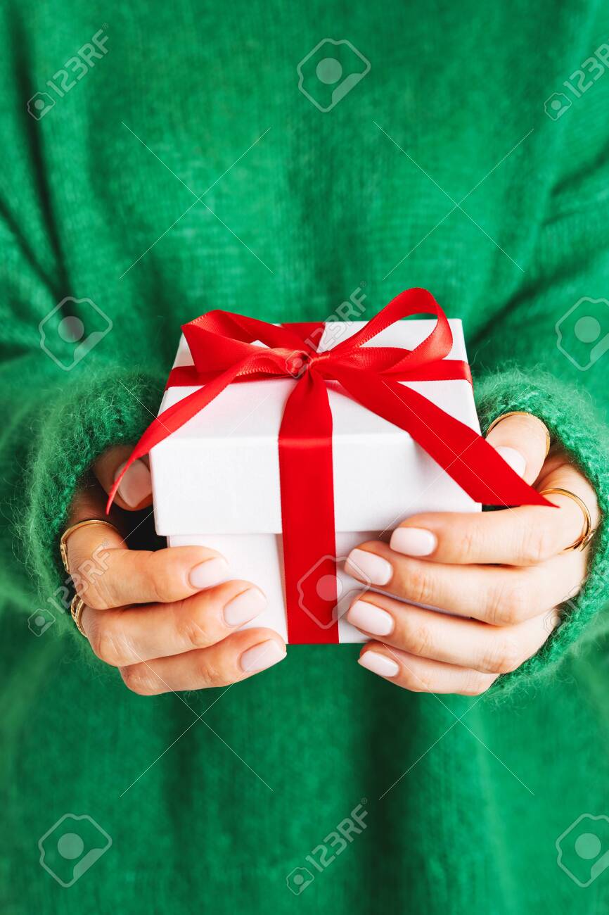 Download Female In Knitted Woolen Green Sweater Holding White Gift Box Stock Photo Picture And Royalty Free Image Image 128402779