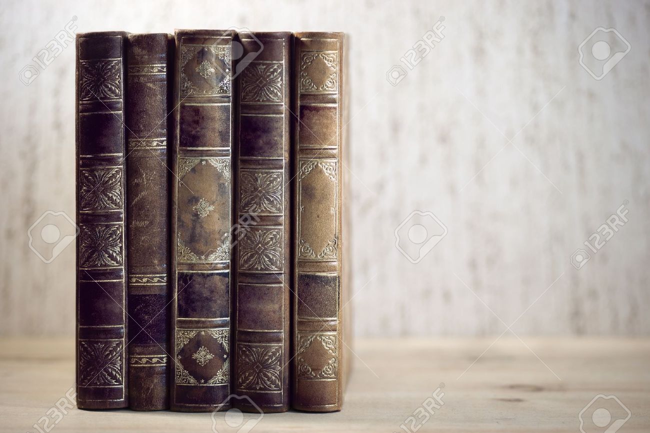 row of leather vintage books on shelf stock photo picture and