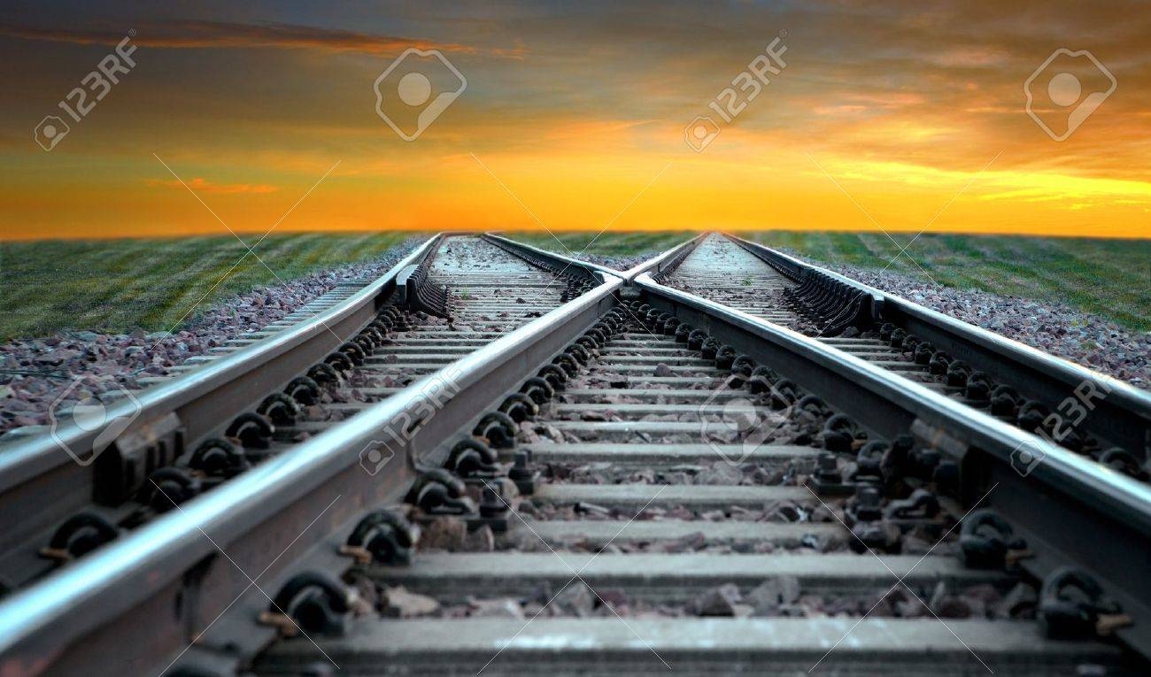 Landscape with railroad disappearing into sunset - 15039929 Landscape with railroad disappearing into sunset - 15039929