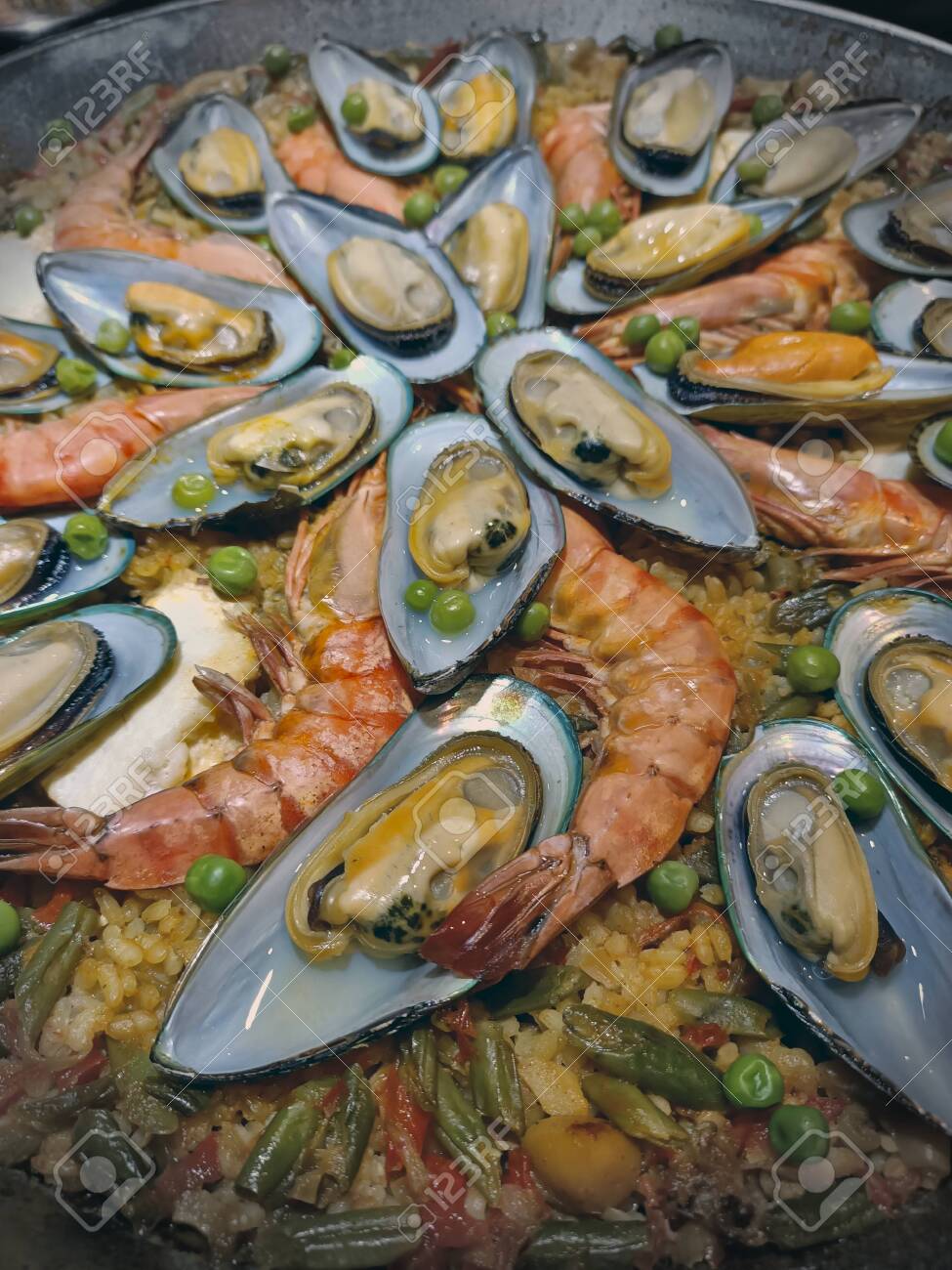 Malaga, Spain, June 2020 - Paella food mix of seefood and veggies - 152124203 Malaga, Spain, June 2020 - Paella food mix of seefood and veggies - 152124203