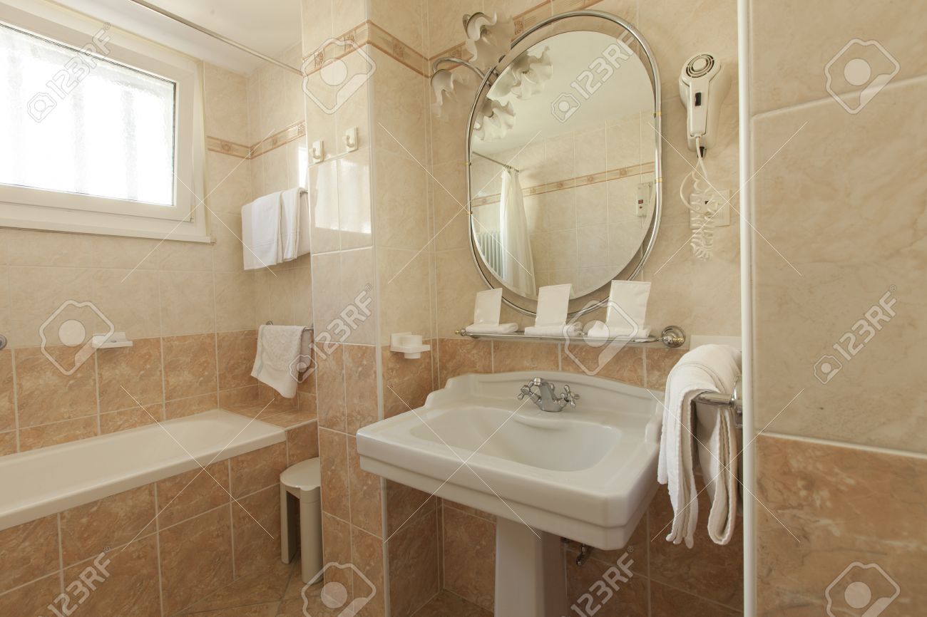 Bathroom With Beige Tiles And Decorations Stock Photo, Picture And ... Bathroom With Beige Tiles And Decorations Stock Photo, Picture And ...