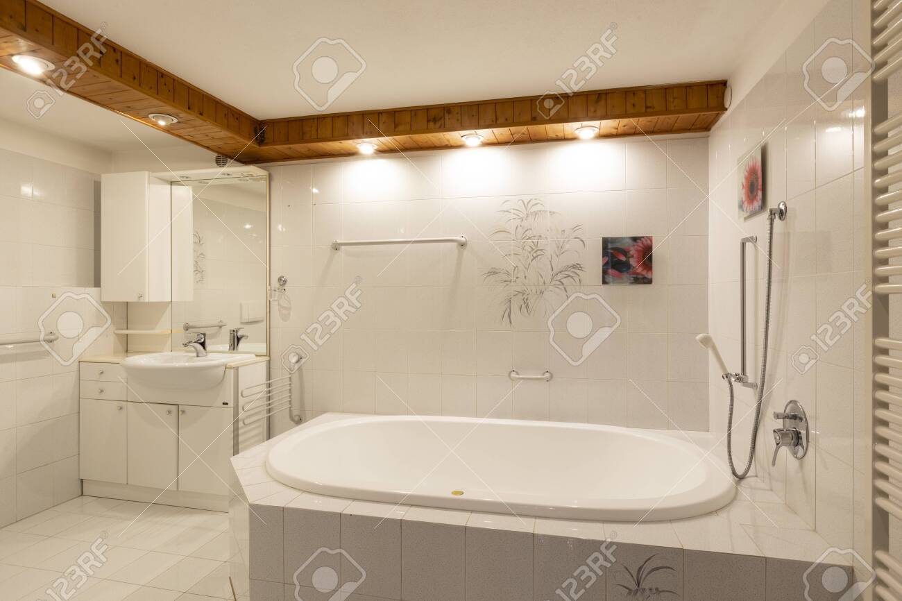 Bathroom With White Tiles And Wooden Ceiling Elegant No One