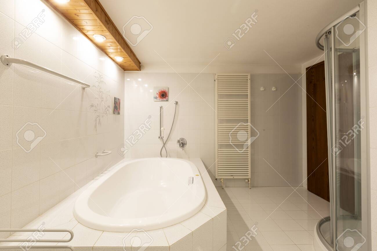 Bathroom With White Tiles And Wooden Ceiling Elegant No One