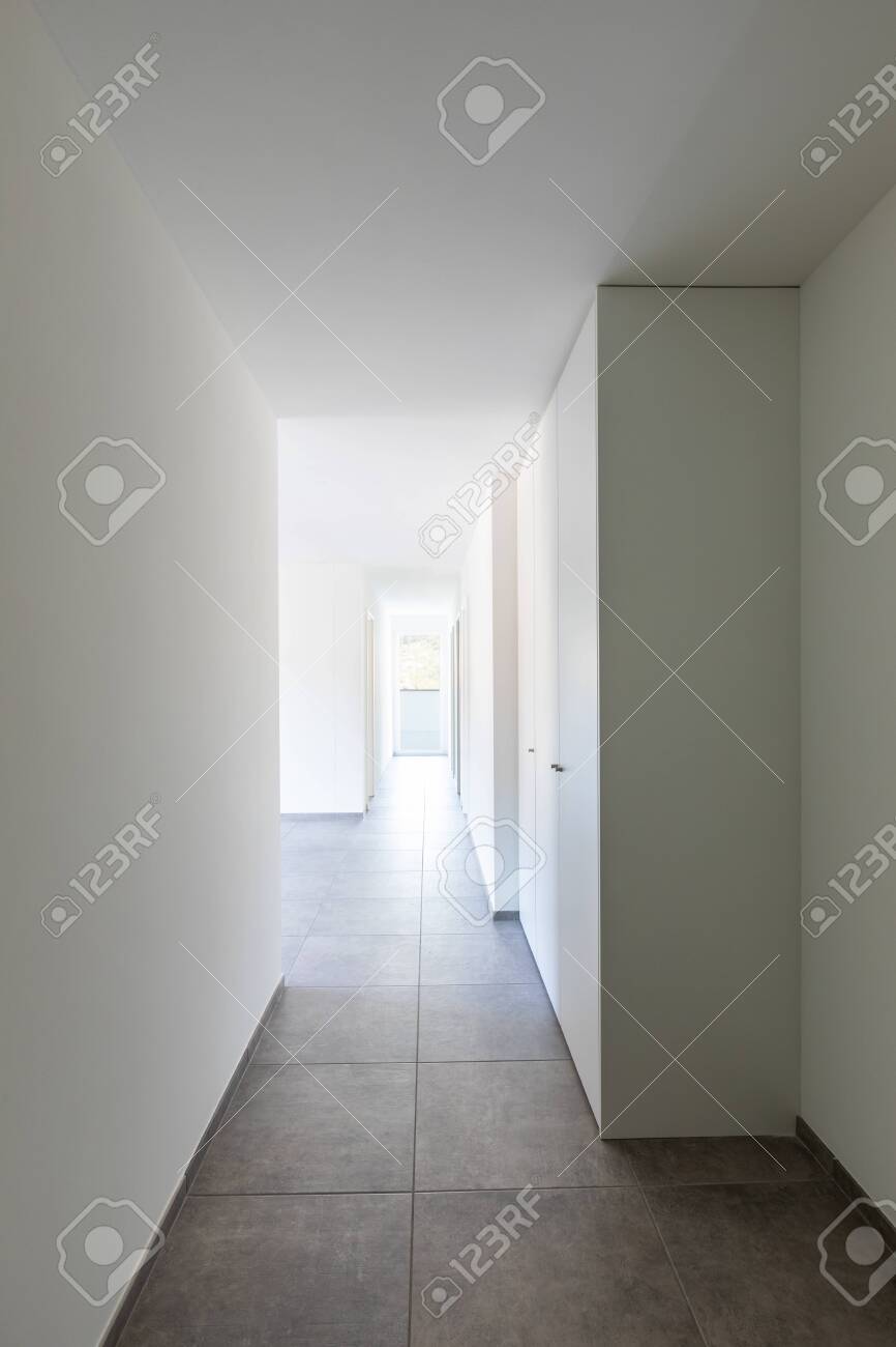 Empty Corridor With White Walls And Window At The End Fitted