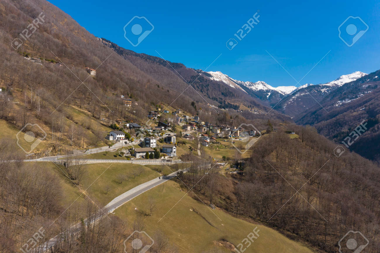 Aerial view of the Morobbia Valley, winter landscape on a sunny day with snow on the mountains. Blue sky - 166495251 Aerial view of the Morobbia Valley, winter landscape on a sunny day with snow on the mountains. Blue sky - 166495251