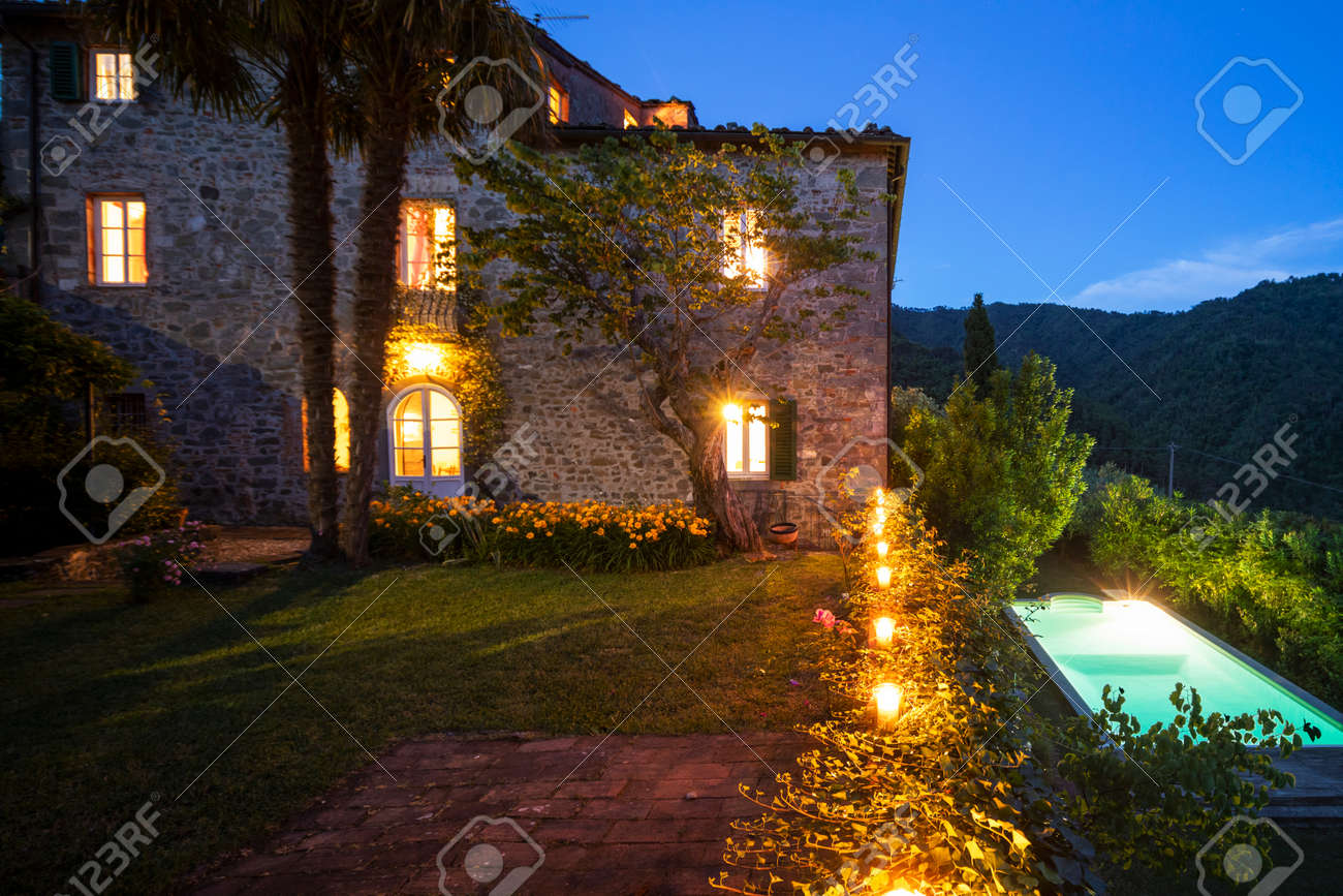 House or cottage at sunset with a beautiful garden in Tuscany. The place is romantic and makes you dream. It is almost evening the silence can be heard from the photograph - 171317499 House or cottage at sunset with a beautiful garden in Tuscany. The place is romantic and makes you dream. It is almost evening the silence can be heard from the photograph - 171317499