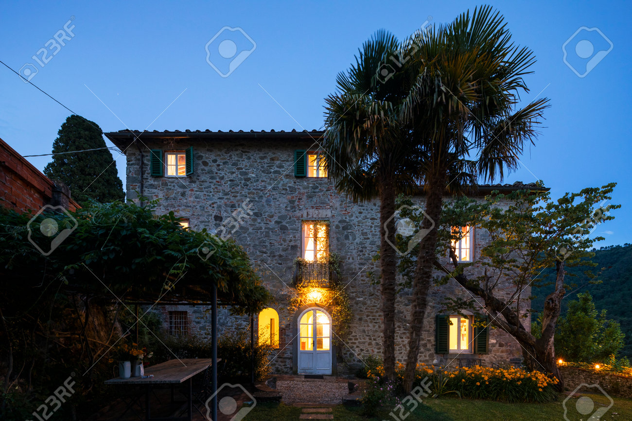 House or cottage at sunset with a beautiful garden in Tuscany. The place is romantic and makes you dream. It is almost evening the silence can be heard from the photograph - 171317500 House or cottage at sunset with a beautiful garden in Tuscany. The place is romantic and makes you dream. It is almost evening the silence can be heard from the photograph - 171317500