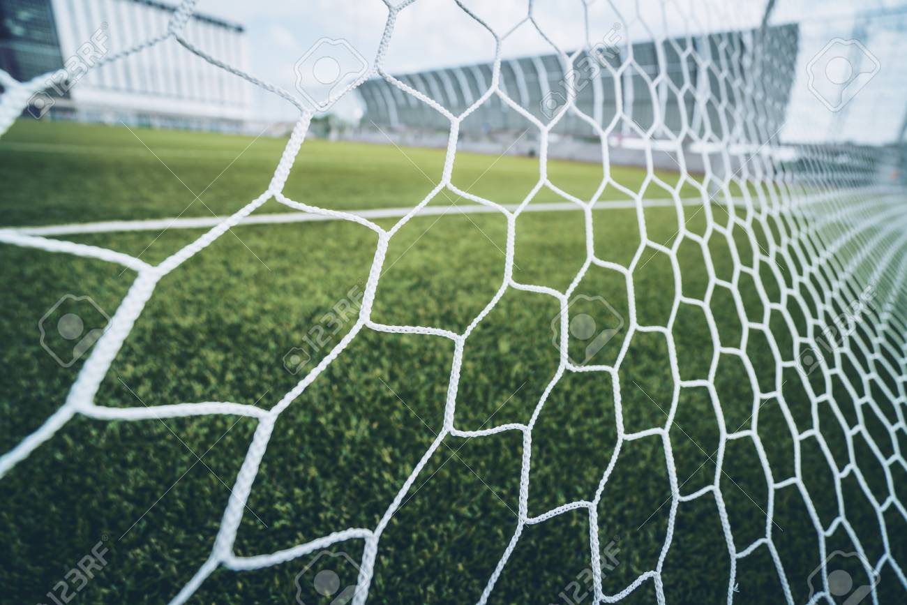 Soccer Football Net Background Over Green Grass And Blurry Stadium Stock Photo Picture And Royalty Free Image Image