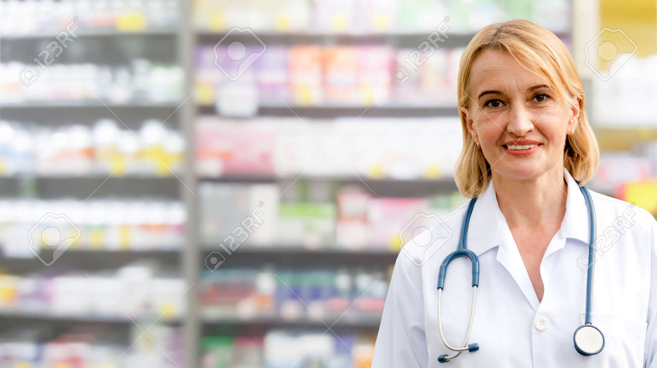 Senior woman pharmacist working in the pharmacy. Medical healthcare and medicine service. - 121833636 Senior woman pharmacist working in the pharmacy. Medical healthcare and medicine service. - 121833636