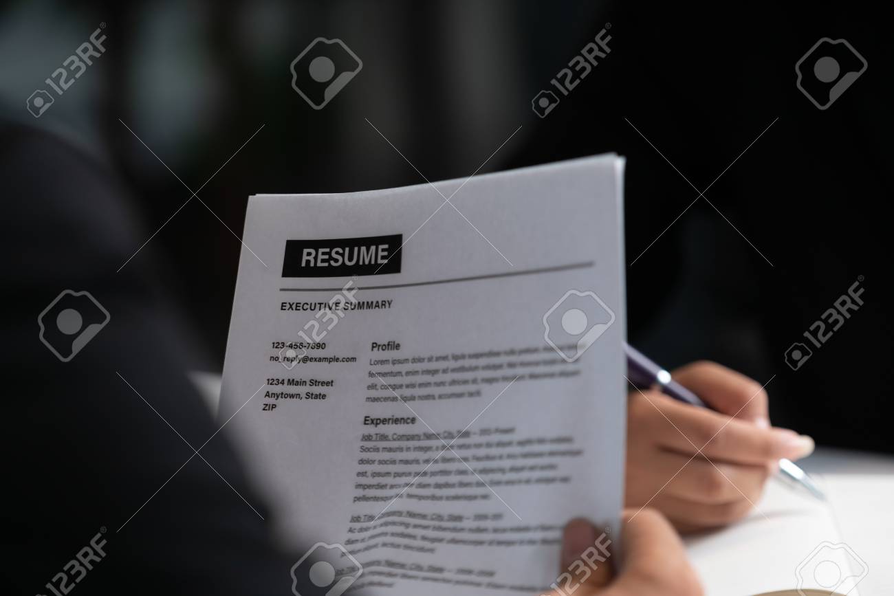 human resources department manager reads cv resume document of recruit resume