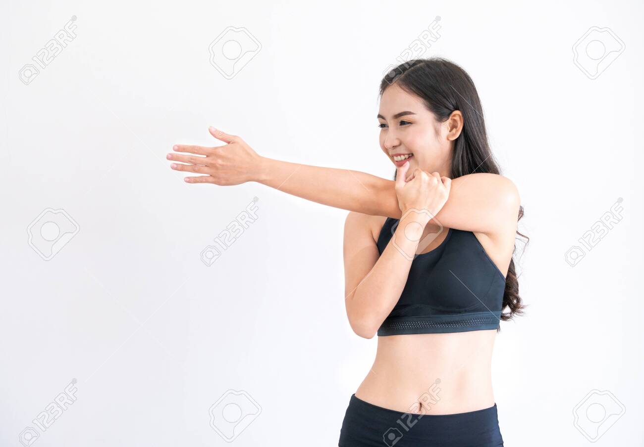 Strong and confident Asian woman in fitness gym. Healthy lifestyle concept. - 121168304 Strong and confident Asian woman in fitness gym. Healthy lifestyle concept. - 121168304