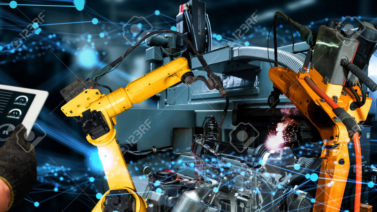 Smart industry robot arms modernization for innovative factory technology . Concept of automation manufacturing process of Industry 4.0 or 4th industrial revolution and IOT software control operation. - 167851207 Smart industry robot arms modernization for innovative factory technology . Concept of automation manufacturing process of Industry 4.0 or 4th industrial revolution and IOT software control operation. - 167851207