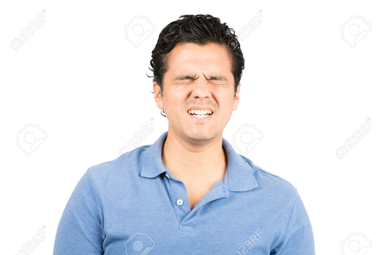 good looking hispanic male in blue collared shirt eyes closed