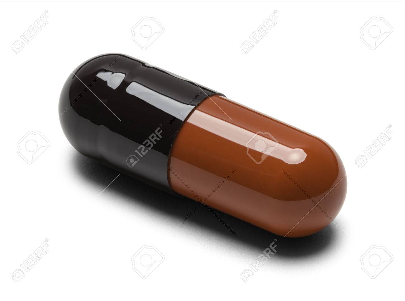 one red and black pill capsule isolate on white background stock