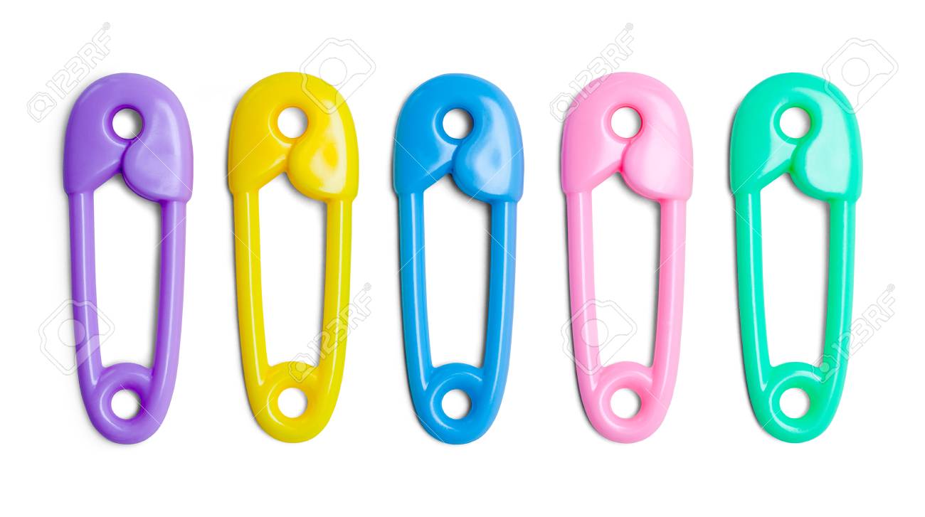 plastic toy baby diaper pins isolated on white background stock