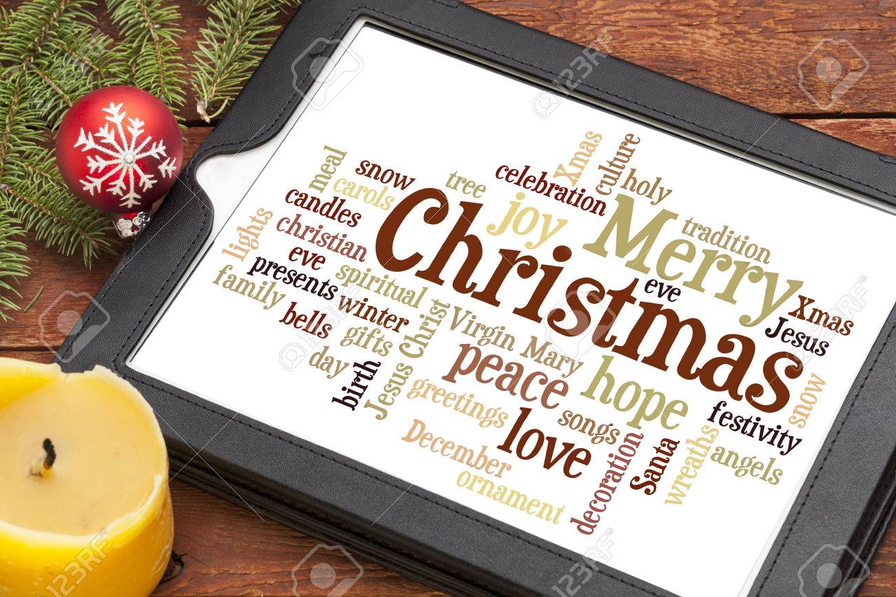 cloud of words or tags related to christmas on a digital tablet words related to christmas