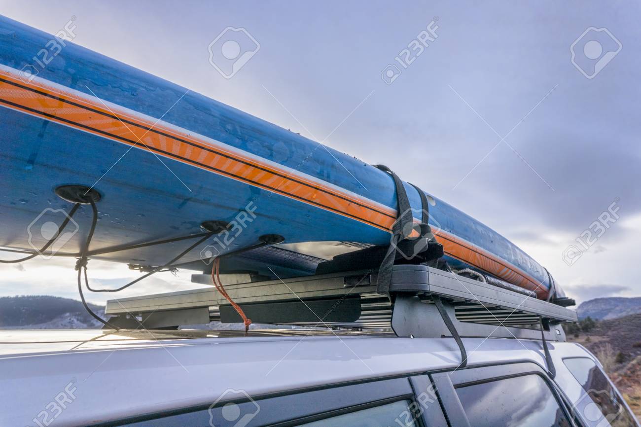 Paddle Board Car Racks >> Racing Stand Up Paddleboard On Roof Racks Of Suv Car Paddle Board Car Racks >> Racing Stand Up Paddleboard On Roof Racks Of Suv Car