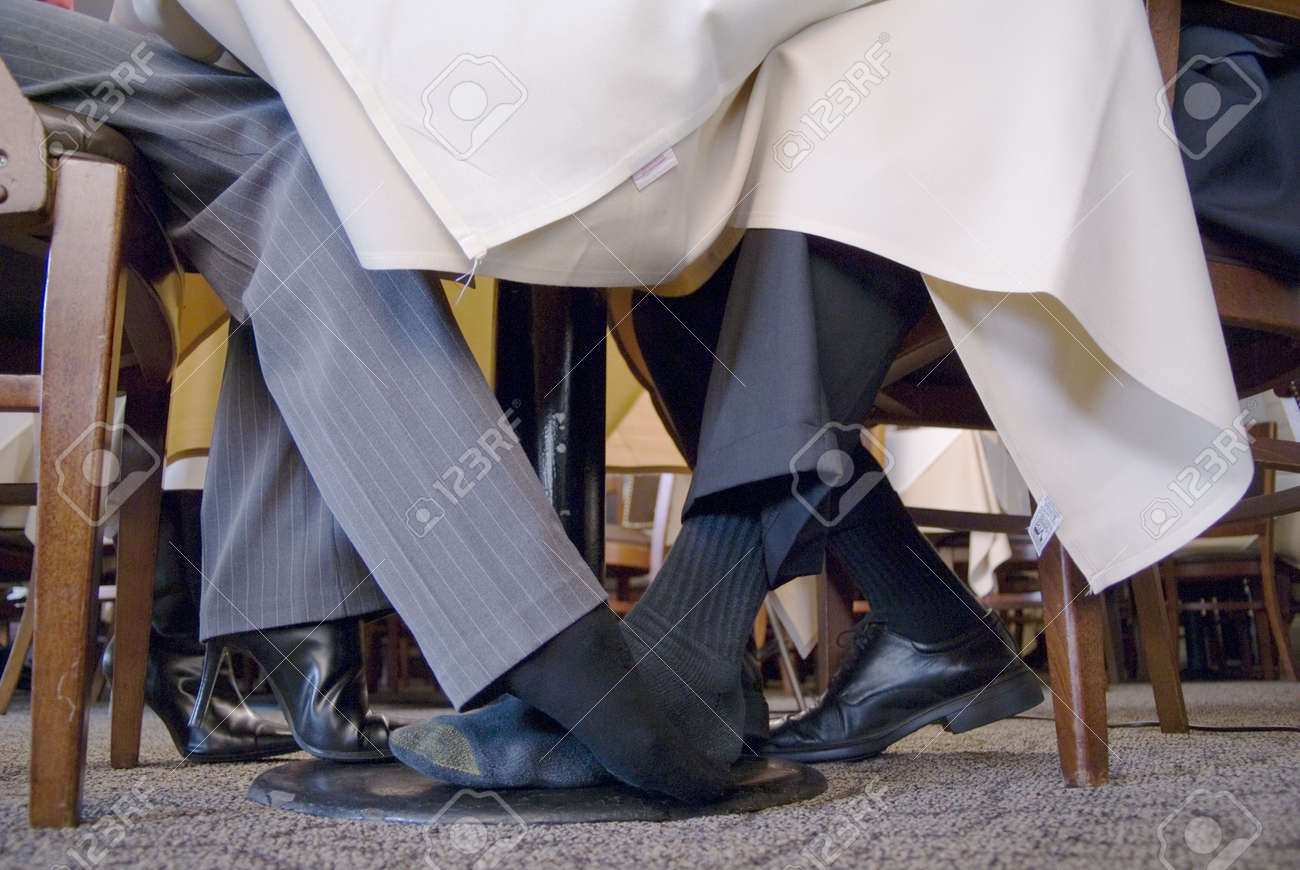 Woman Playing Footsie Under The Table image