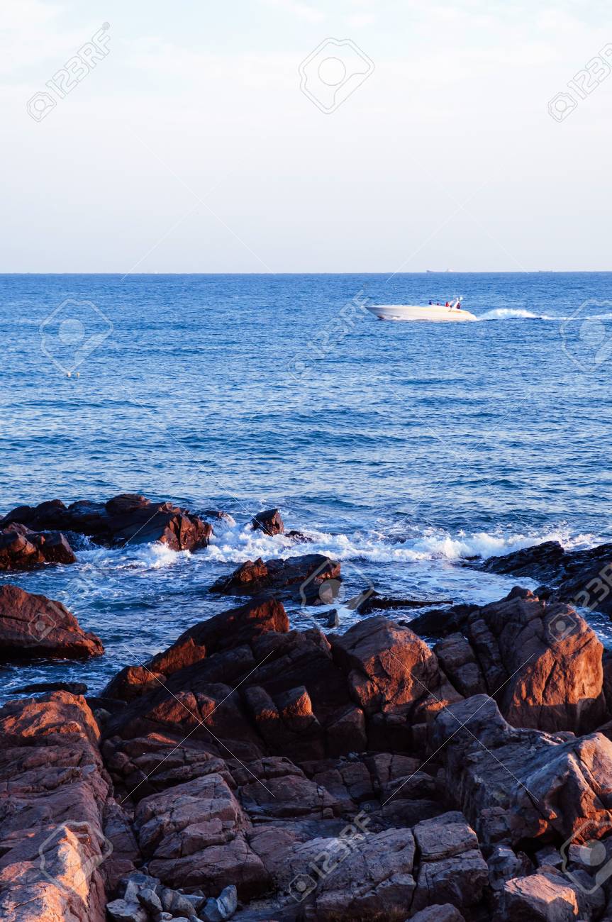 Boat And Rock Beach Dongbaek Island Sunset In The Haeundae District