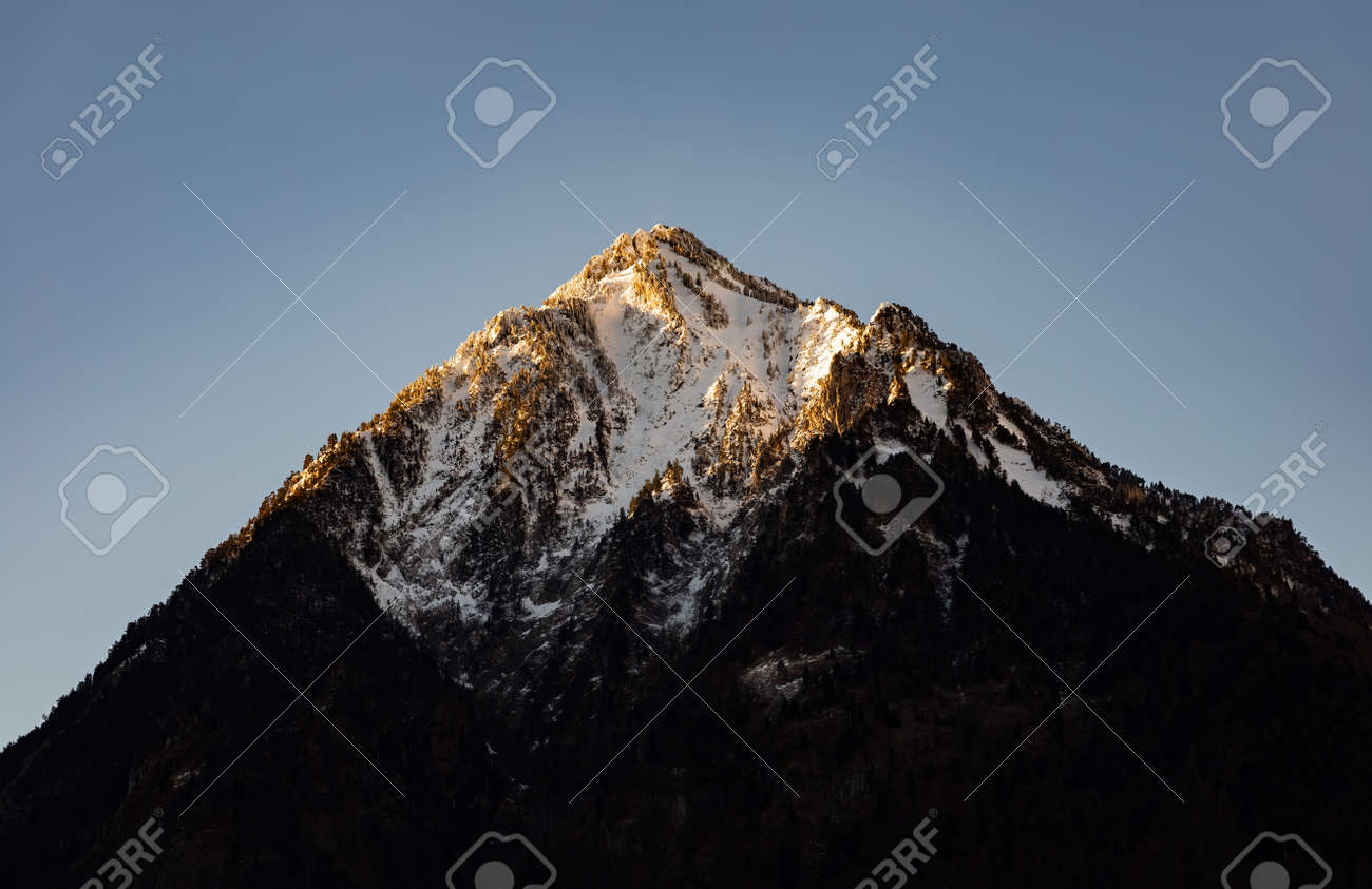 Large snowy dome on mountain top close-up. Firn on stony mountain ...