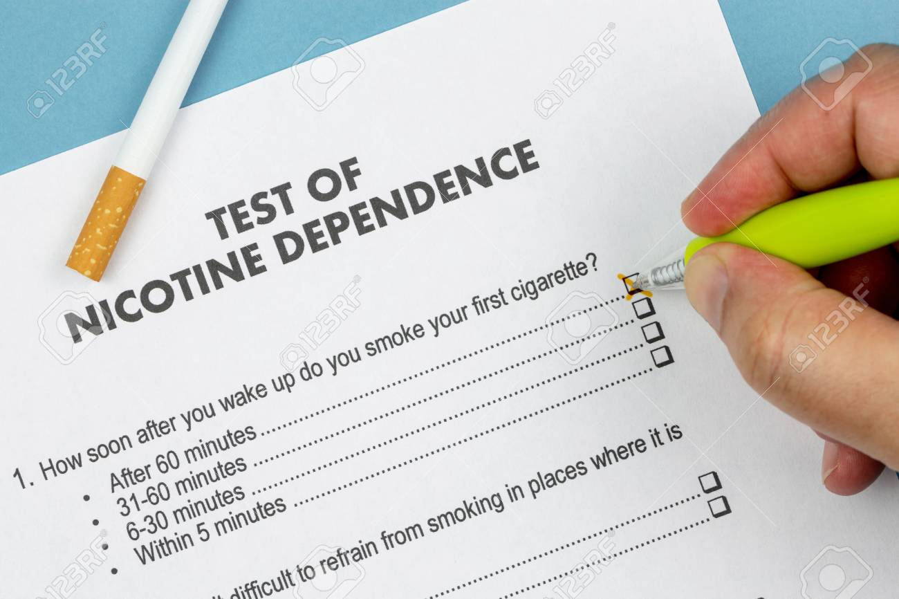 Man Doing A Test Of Nicotine Dependence With Yellow Pen And A