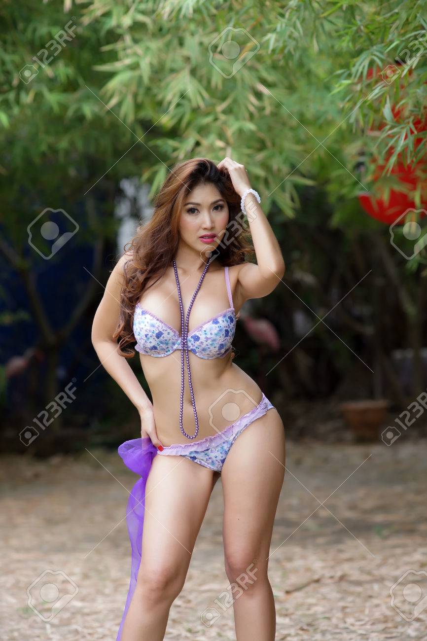 Beautiful Asian Woman In Lingerie Voluptuous Posing Outdoors. Stock Photo,  Picture And Royalty Free Image. Image 25031919.