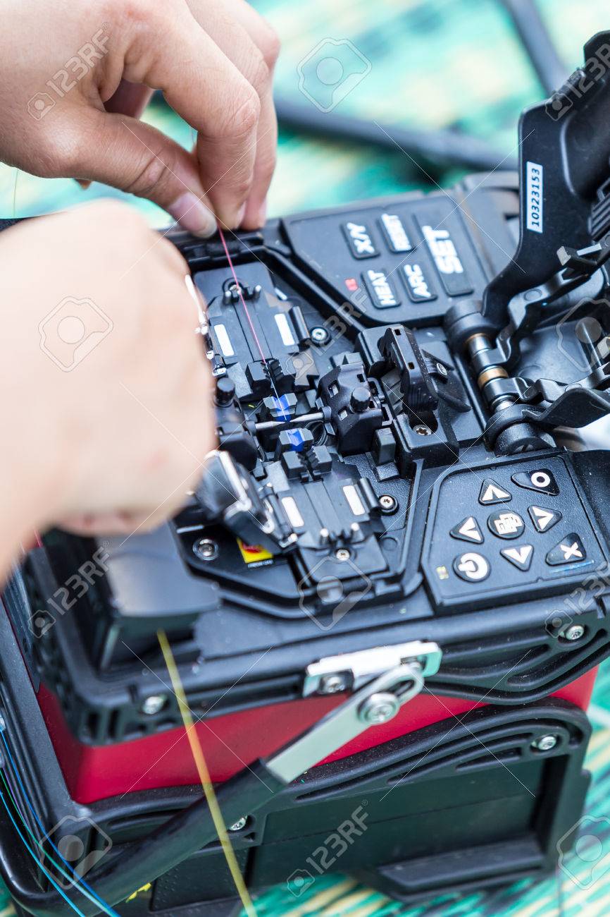 fiber optic fusion splicer in field stock photo picture and royalty fiber splicing technician