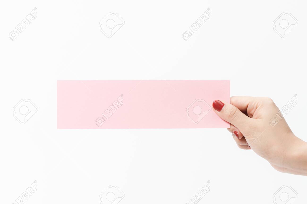 Close up women holding pink blank paper on white background. Free space, ready for type with text banner. - 137151924 Close up women holding pink blank paper on white background. Free space, ready for type with text banner. - 137151924