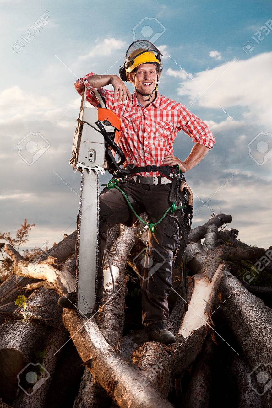 smiling lumberjack with chainsaw - 23694438 smiling lumberjack with chainsaw - 23694438