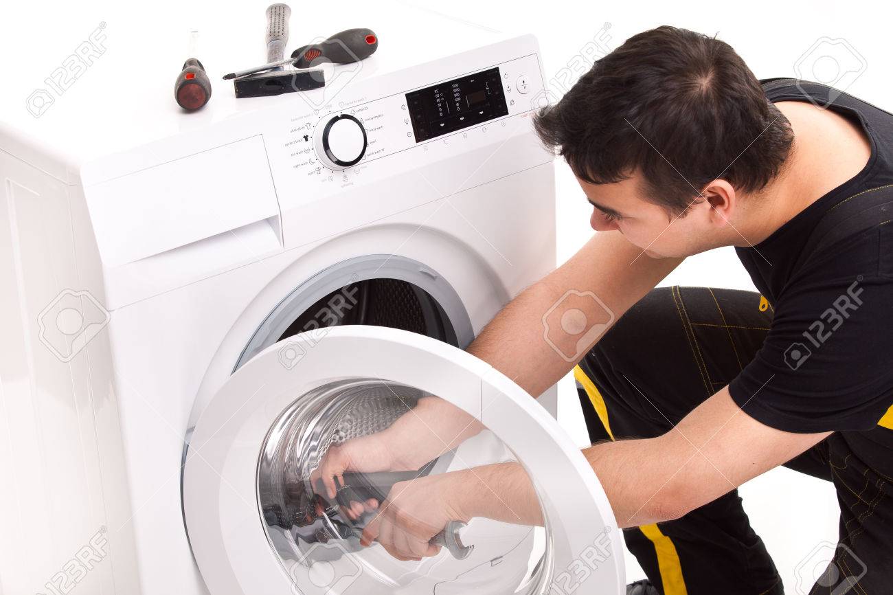 studio photo of washing machine repairman - 23735090 studio photo of washing machine repairman - 23735090