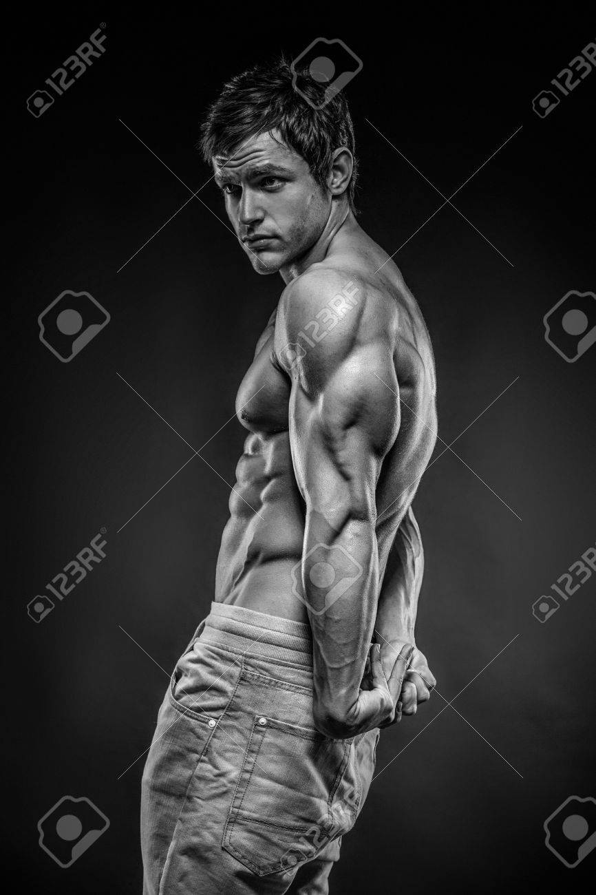 Strong Athletic Man Fitness Model posing back muscles, triceps, latissimus - 29565577 Strong Athletic Man Fitness Model posing back muscles, triceps, latissimus - 29565577