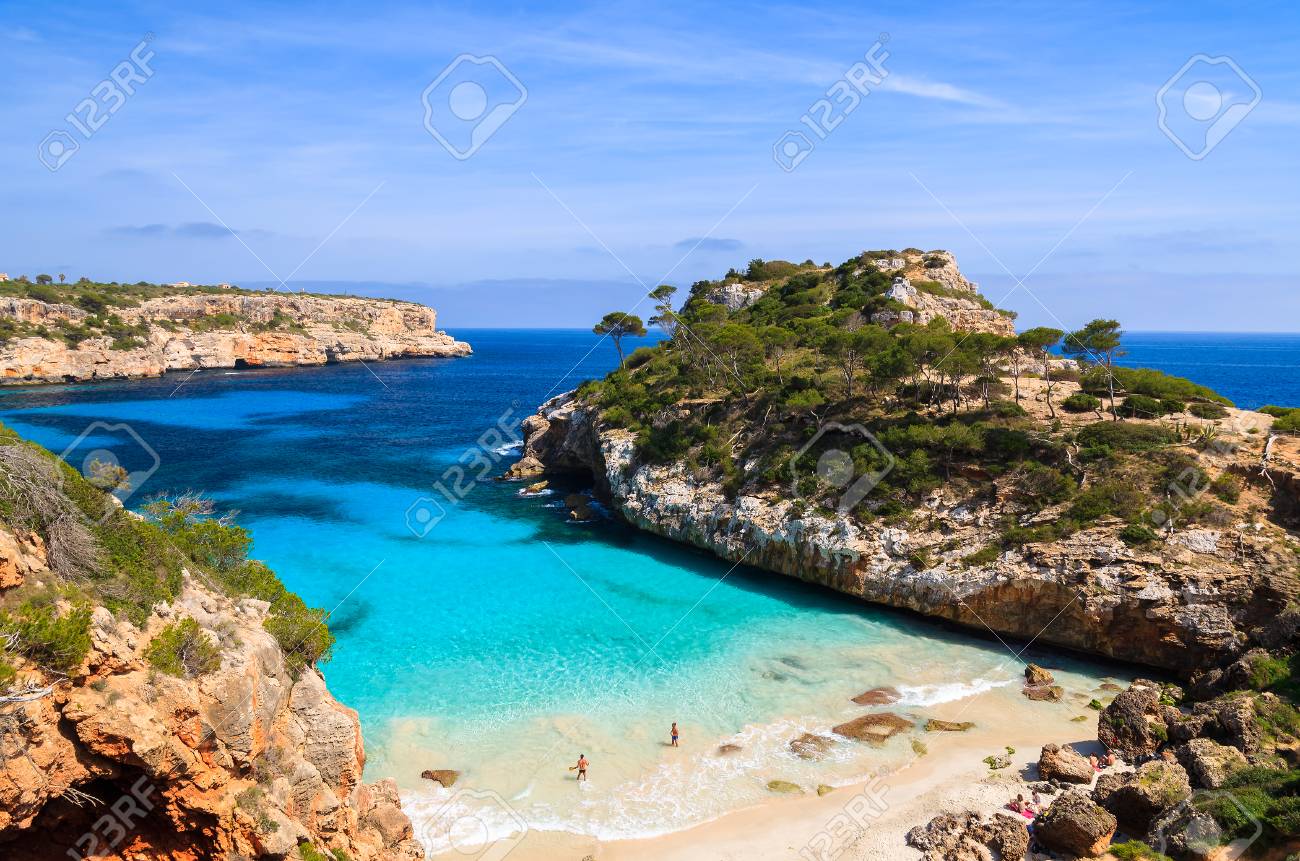 Couple Of People On Cala Des Moro Beach Majorca Island Spain